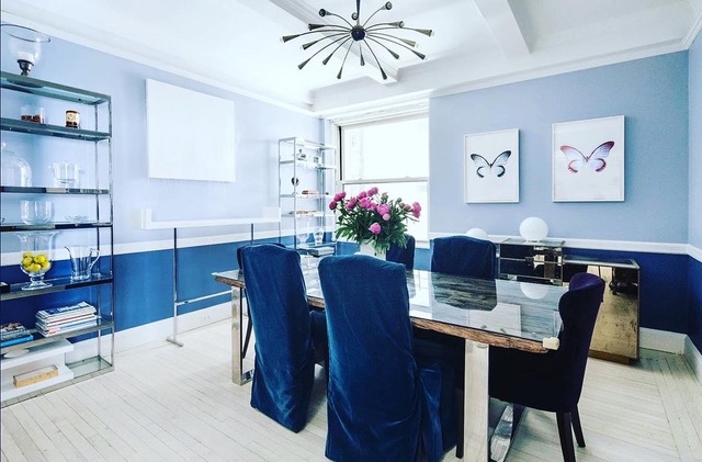 bright dining room with blue chairs