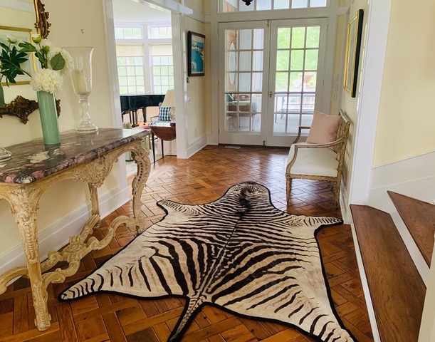 bright hallway with animal print rug